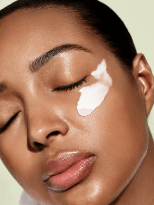 Woman with skincare product on face - Calm and Remedy Dry Skin