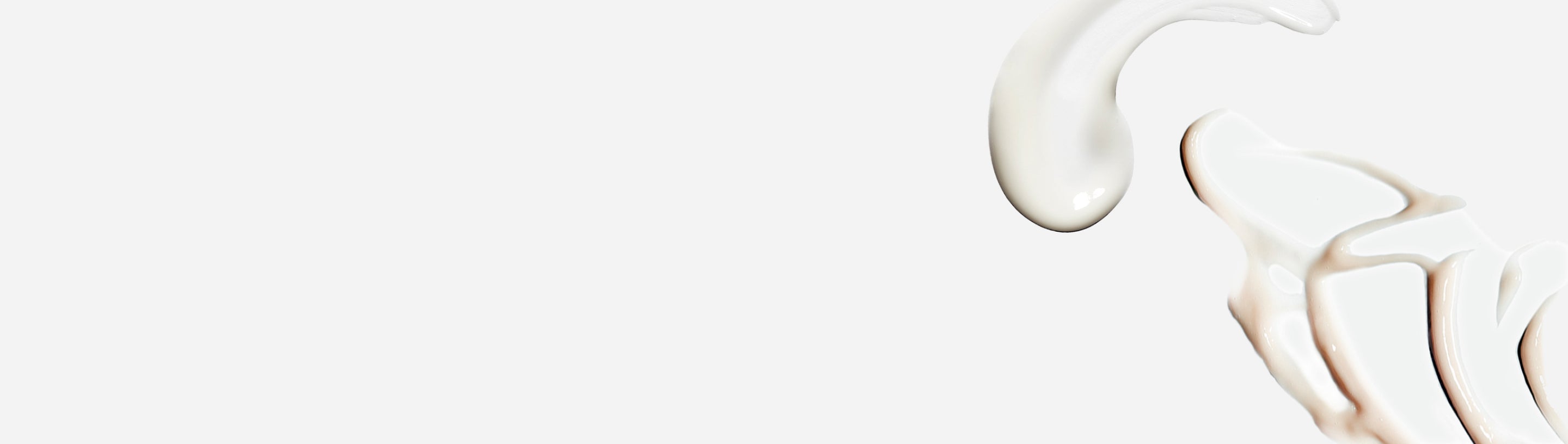 Creams smeared on a white background.