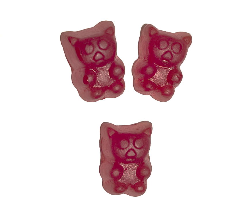 Three pink bear-shaped gummy candies on a white background